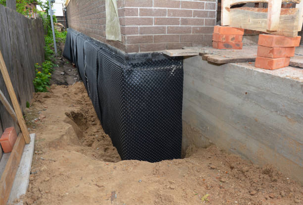 Happy homeowners after waterproofing job in West Manchester